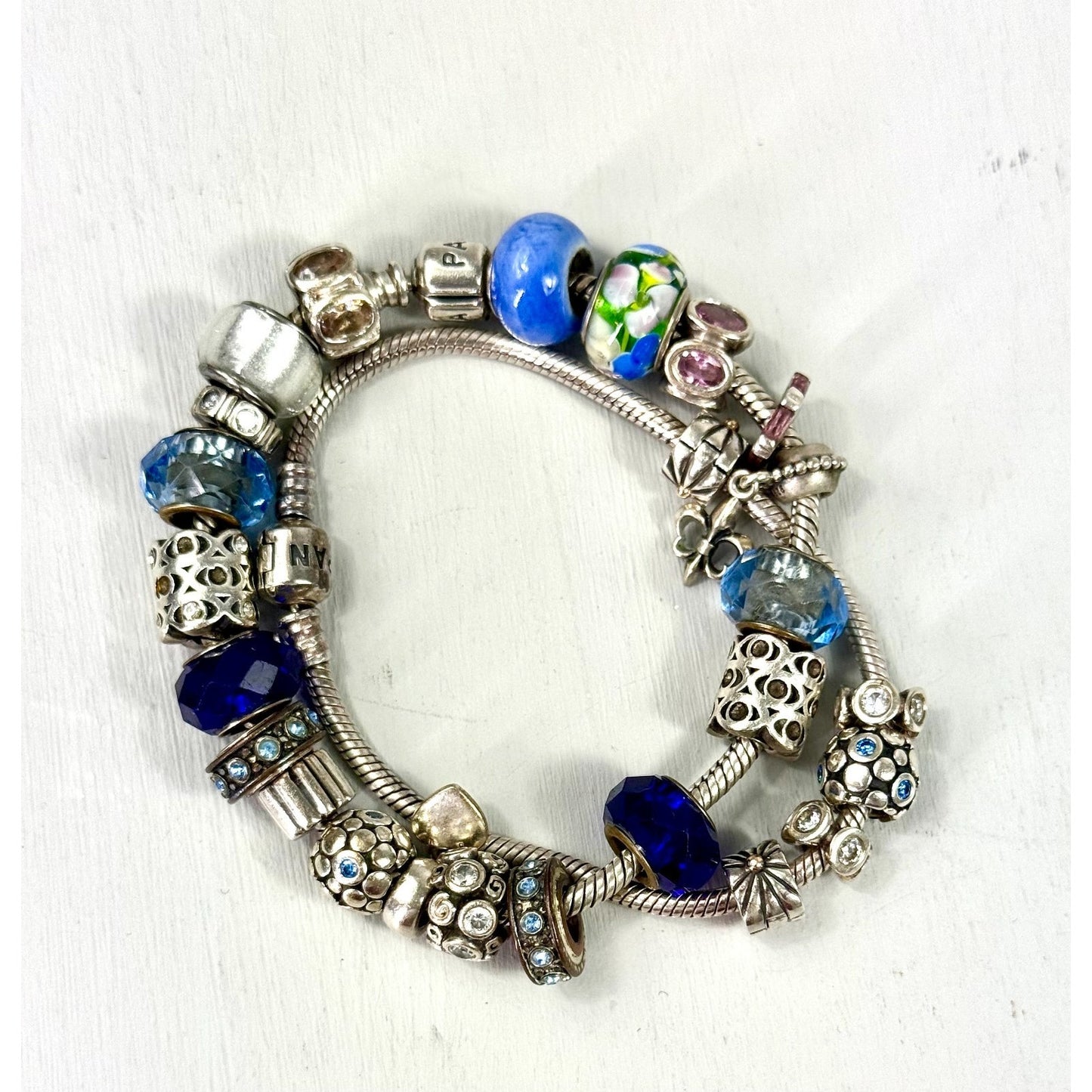 Pandora Vintage silver bracelet set with 20 charms, and one with 5