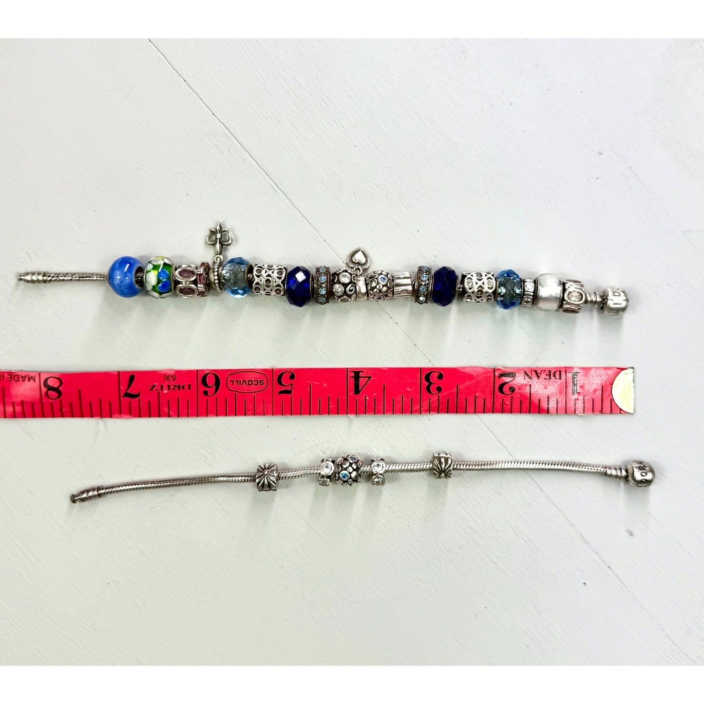 Pandora Vintage silver bracelet set with 20 charms, and one with 5