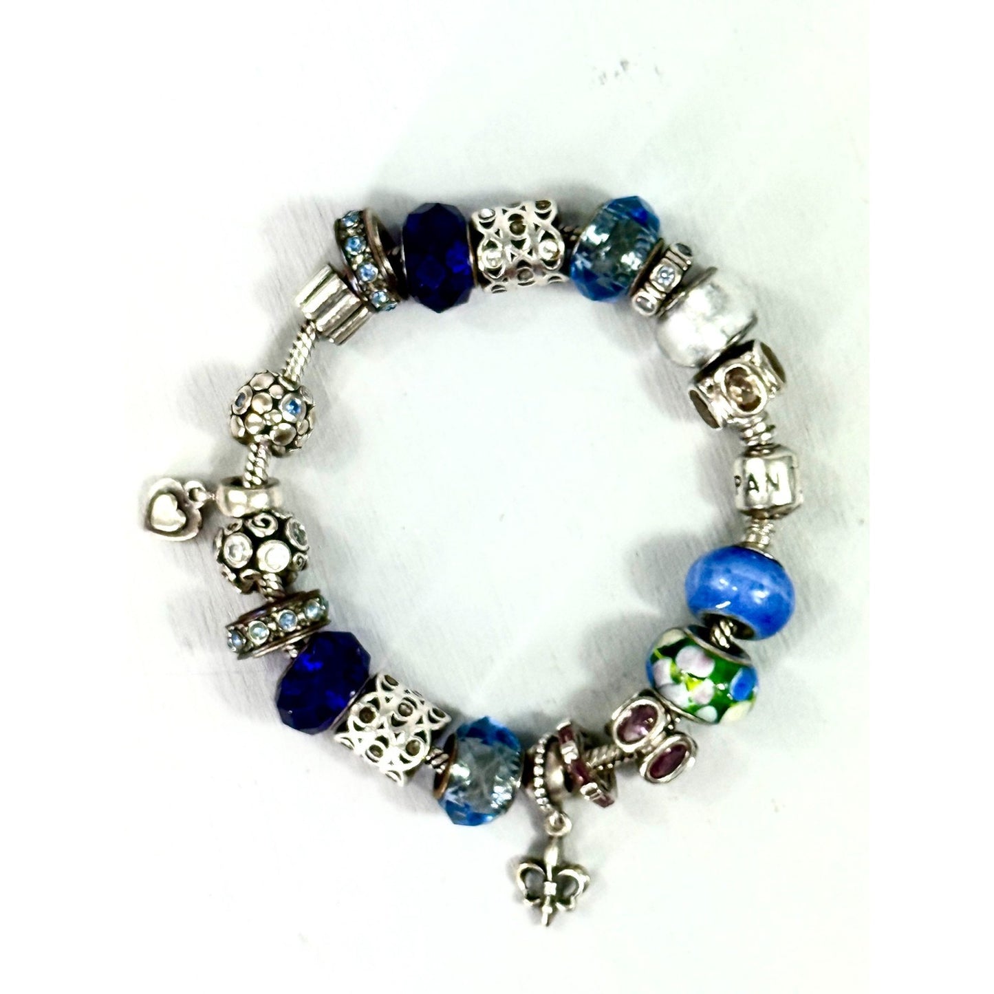 Pandora Vintage silver bracelet set with 20 charms, and one with 5