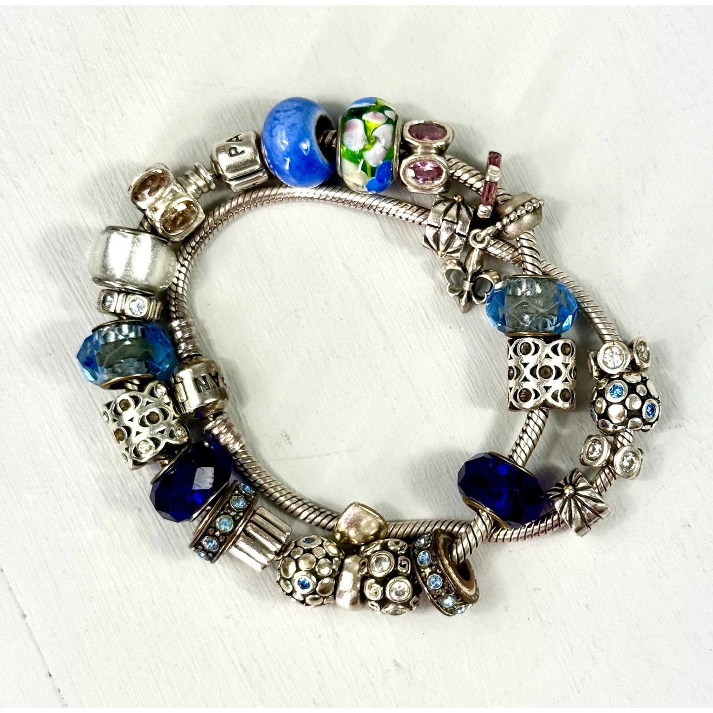 Pandora Vintage silver bracelet set with 20 charms, and one with 5