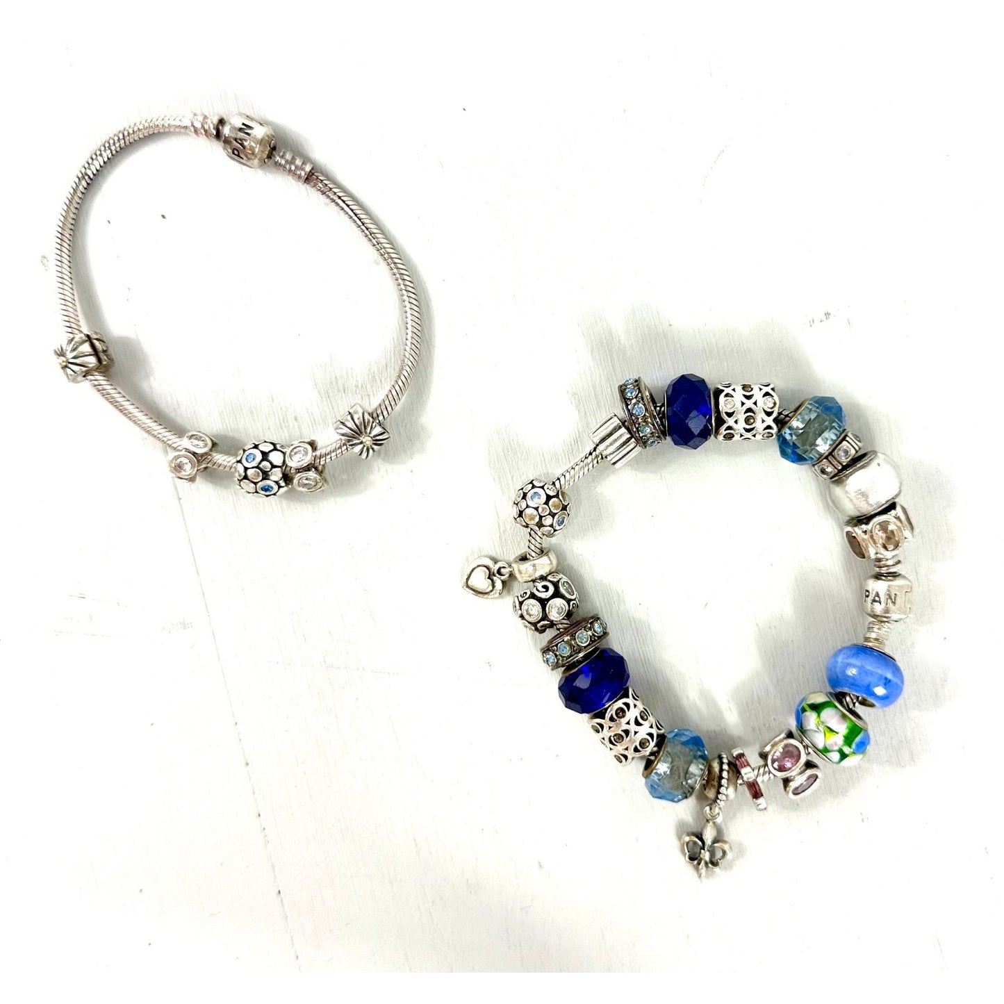 Pandora Vintage silver bracelet set with 20 charms, and one with 5