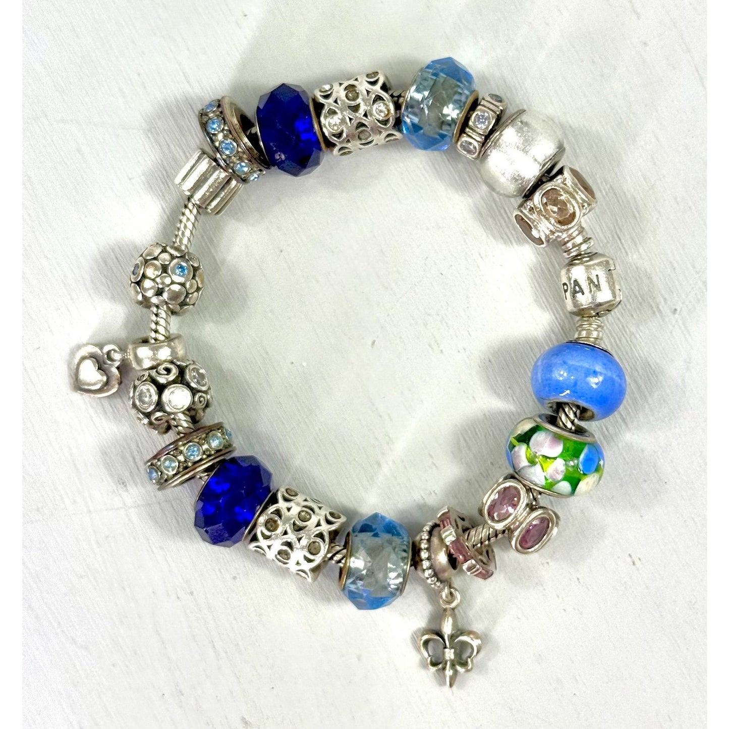 Pandora Vintage silver bracelet set with 20 charms, and one with 5