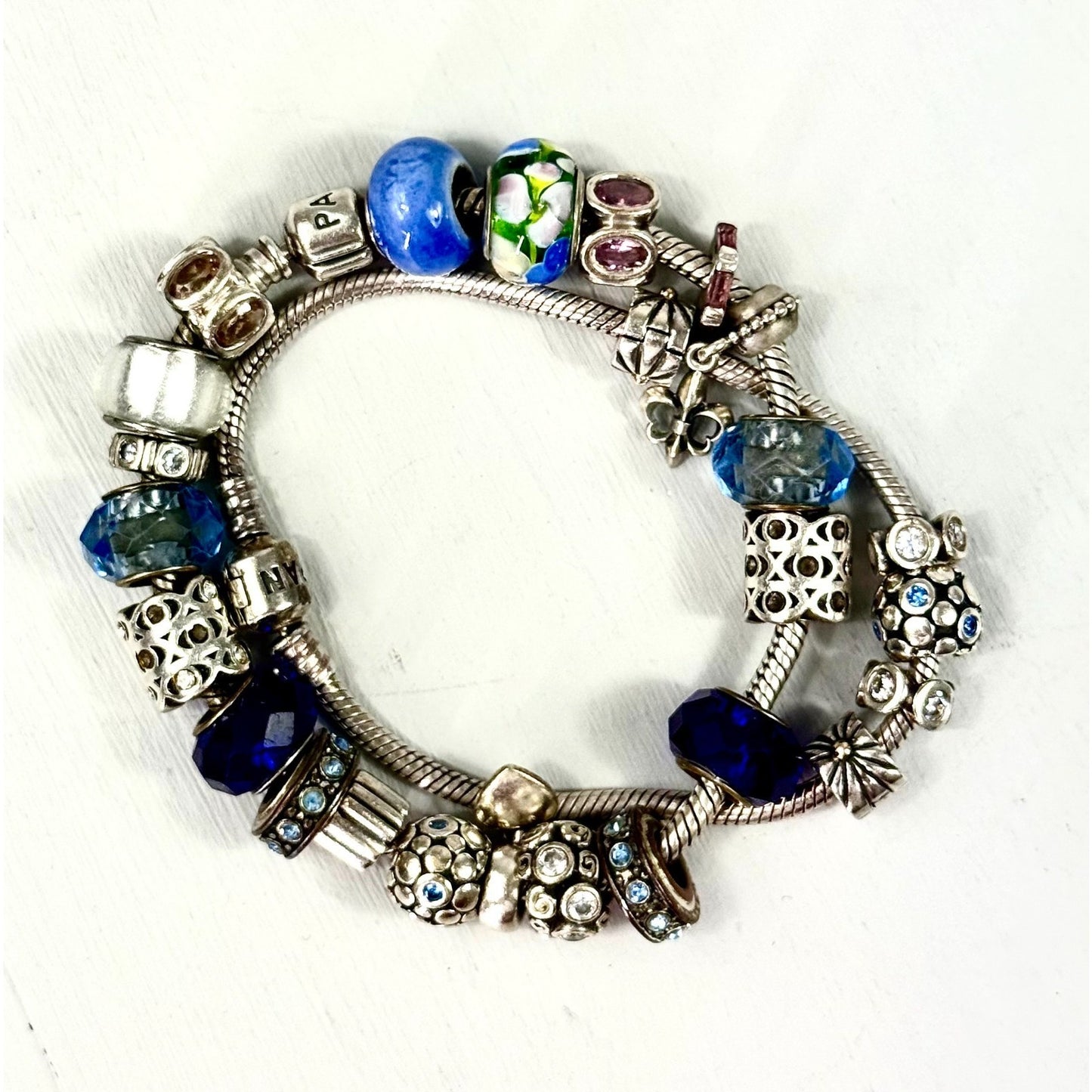 Pandora Vintage silver bracelet set with 20 charms, and one with 5