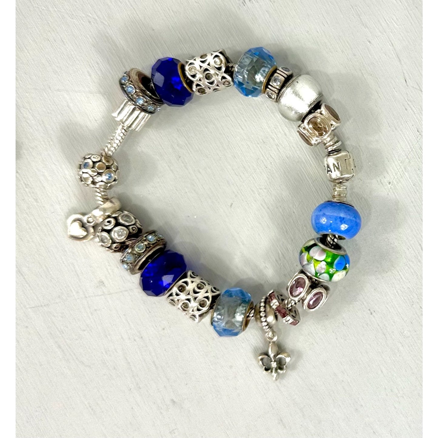 Pandora Vintage silver bracelet set with 20 charms, and one with 5