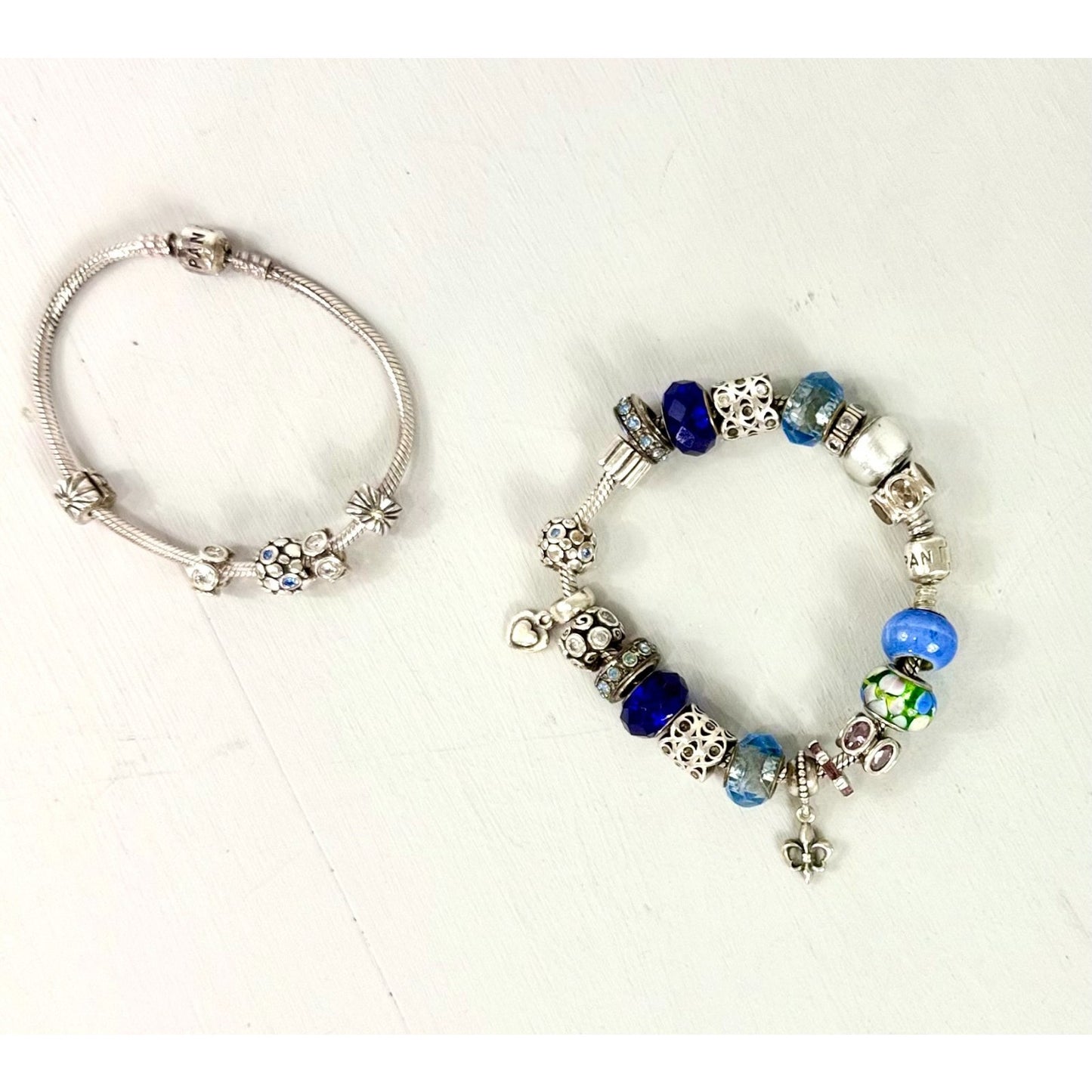 Pandora Vintage silver bracelet set with 20 charms, and one with 5