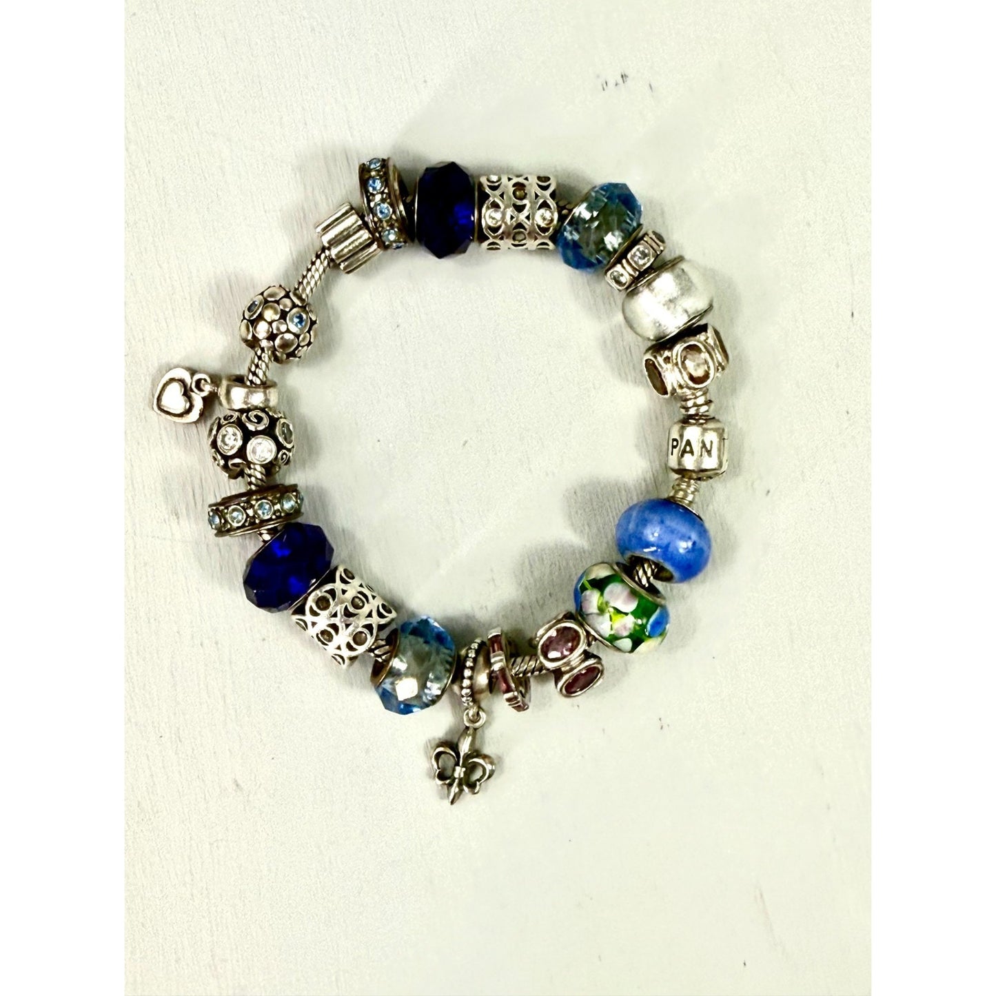 Pandora Vintage silver bracelet set with 20 charms, and one with 5